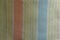 Vertical multicolored stripes on white fabric