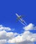 Vertical nature background with aircraft and Jet trailing smoke in the sky. Airplane and condensation trail