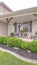 Vertical Neatly landscaped small garden in front of porch