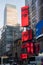 Vertical Neon Subway sign and advertising displays at the entrance to the Times Square Square