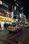 Vertical night street view with colorful advertising