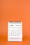 Vertical of November 2024 table calendar on orange background