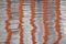 Vertical orange stripe reflection background