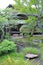 vertical outdoor footpath, green plants and pavilion in the Japanese zen garden