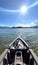 Vertical outdoor kayaking water sport adventure on the ocean with Sunday, mountain and blue sky