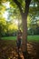 Vertical outdoors lifestyle portrait of young happy and beautiful Asian Chinese woman enjoying relaxed and cheerful at city park