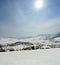 Vertical panorama of idyllic snowy winter landscape in the mountains
