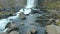 Vertical panorama from rocks and water on a ground to waterfall Oxararfoss in Iceland in autumn day