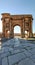 Vertical panoramic shot of an Arch of Trajan Ancient Roman landmark in Timgad, Algeria