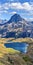 Vertical panoramic view at Midi Ossau mountain peak and Lake Gentau from the mountain pass Ayous in Franch Atlantic Pyrenees, as