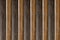 Vertical parallel dark and light lines wooden boards, background base natural