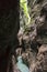 Vertical of the Partnachklamm canyon and a thin river flowing in the middle, Germany