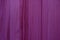 Vertical Pattern of Deep Magenta Colored Wooden Wall Surface for Background