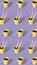 Vertical pattern made of coffee cups with female doll hands and legs on lavender background