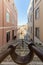 A Vertical Perspective of a Narrow, Cobblestone Street in Lisbon, Portugal: A Daytime Capture of Steps Leading Down a Hill, and a