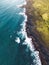 Vertical photo, aerail view of waves crushing on the shore - Iceland