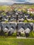 Vertical photo, aerial view of new houses, family homes in the suburbs of Slovenia