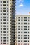 Vertical photo of apartment building exterior with metal emergency stairs