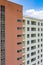 Vertical photo of apartment building with window and balcony