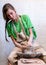 Vertical photo of beautiful attractive sweet gorgeous nice adorable good-looking calm lady in her dirty apron workwear she sit in