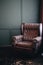 Vertical photo of a brown upholstered chair with a carriage tie. Armchair near the window on background of green wall