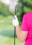 Vertical Photo gloved hand with a golf club and a space