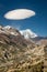 Vertical photo of Manang valley, Tilicho peak and odd cloud above, Himalayas