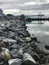Vertical photo of a pier with rocks