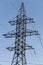 Vertical photo: Power Tower on blue sky background.