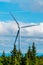 Vertical photo: A tall wind turbine