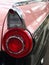 Vertical photo of a vintage Ford Fairlane tail light in perspective