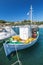 Vertical photo of vintage wooden fishing boat