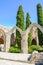 Vertical photography of the inner courtyard with typical arches in Bellapais Abbey in Turkish Northern Cyprus. The historical