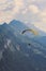 Vertical photography of tandem paragliding in Interlaken, Switzerland in bad weather. Flying over Swiss Alps in summer. Adventure