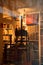 Vertical picture of antique bookshop with old printing press inside in city center of Strasbourg, France. Education and books. Row