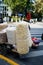 Vertical picture of a cart carrying various snacks through the streets of Shanghai, China