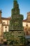 Vertical picture of the Cider Tree monument El Arbol de la Sidra in Cimadevilla, the old town of Gijon, Asturias, Spain
