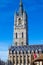 Vertical picture of the facade of the Belfry Het Belfort of Ghent taken from Sint-Baafsplein, in Belgium, Europe, during a sunny