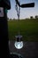 Vertical picture of a magical lamp against a field