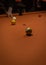 Vertical picture of an orange billiard board with balls