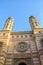 Vertical picture of ornamental front side facade and two onion domes of the Great Synagogue in Hungarian Budapest. Dohany Street