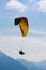 Vertical picture of tandem paragliding in Interlaken, Switzerland. Silhouettes of paragliders and stunning mountains. Adventure