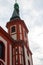 Vertical picture of the tower of the church of St. Wenceslaus Kostel Sv. Vaclava, a red and white church in the picturesque town