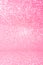 Vertical pink glitter background with blur