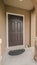 Vertical Porch and front door of modern house with garden