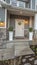 Vertical Porch and yard at the facade of a home with stairs leading to the front door