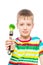 Vertical portrait of a boy with broccoli on a fork