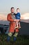 Vertical portrait of a Slavic man with a baby in historical costume