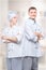 vertical portrait of a successful team of professional chefs in suits against the background