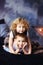 Vertical portrait of two children, boy and girl, brother and sister, siblings, laying in bed in loft styled bedroom. Curly blonde